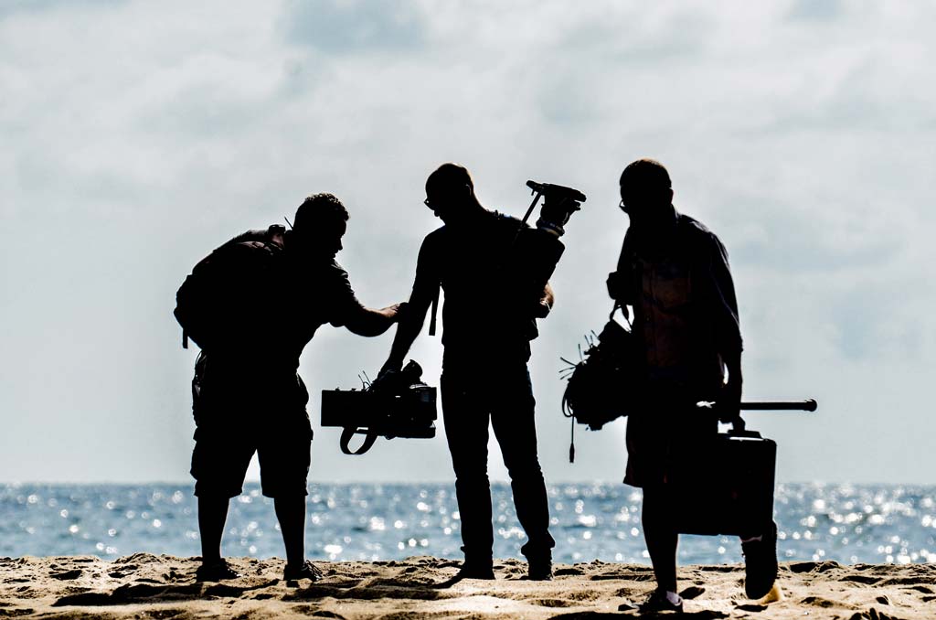 Members of a video crew — Photo by Stephane YAICH on Unsplash